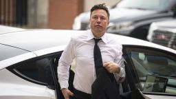 Elon Musk, chief executive officer of Tesla Inc., arrives at court during the SolarCity trial in Wilmington, Delaware, U.S., on Tuesday, July 13, 2021. Musk was cool but combative as he testified in a Delaware courtroom that Tesla's more than $2 billion acquisition of SolarCity in 2016 wasn't a bailout of the struggling solar provider. 