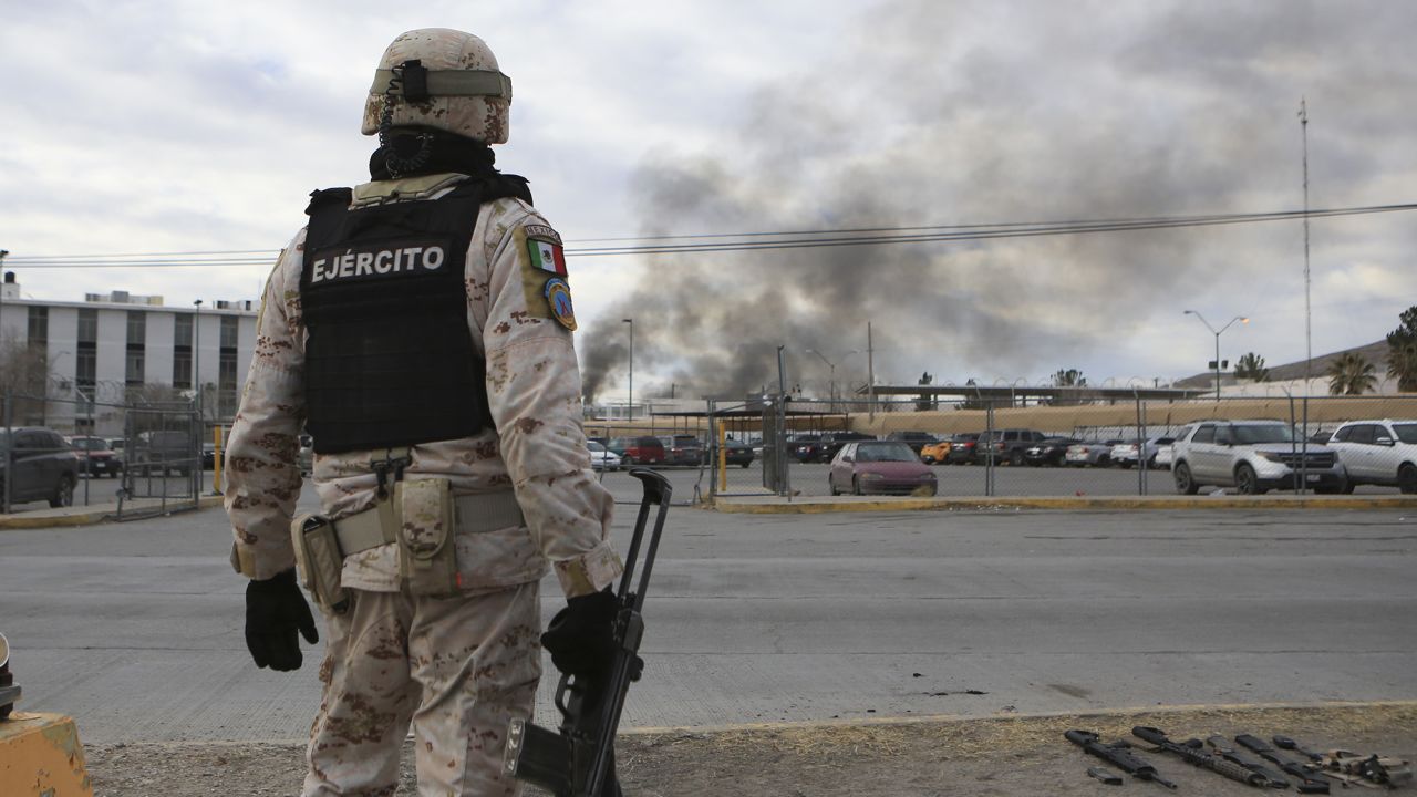 A Mexican soldiers stands guard outside a state prison in Ciudad Juarez, Mexico on Sunday after regaining control of the facility. 
