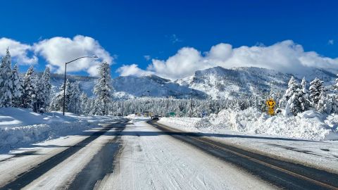 This Sunday, Jan. 1, 2023, photo released by Caltrans District 3, shows Sierra highway back open but chain controls remain in effect as crews clean up in South Lake Tahoe, Calif. 