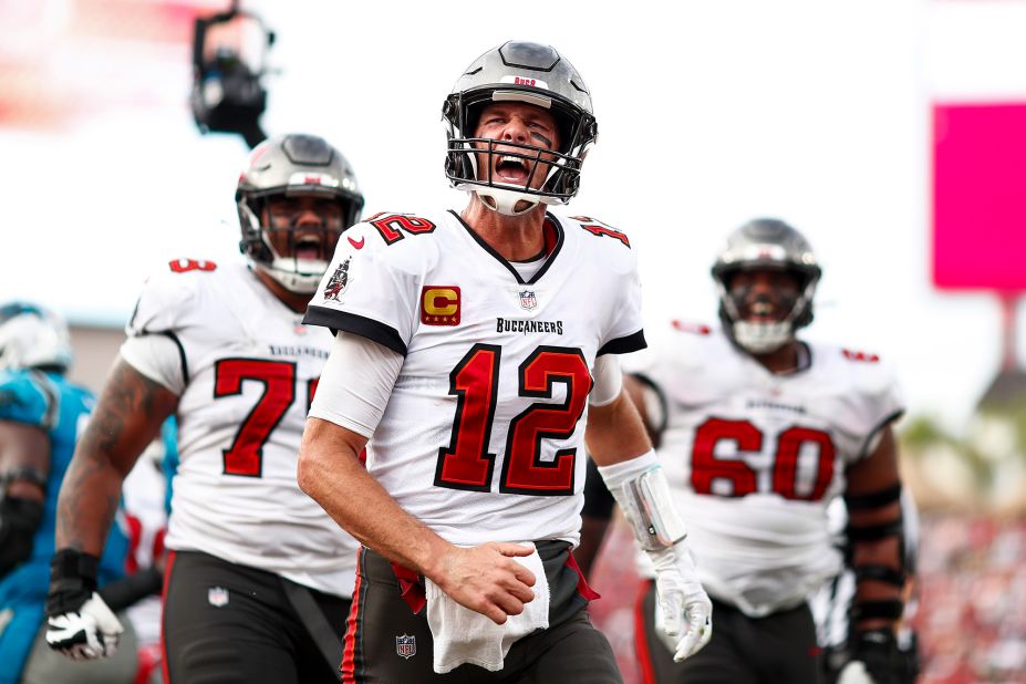 Brady celebrates after scoring a rushing touchdown against Carolina in January 2023. The Buccaneers clinched a postseason berth — and their second straight NFC South title — with a 30-24 win.