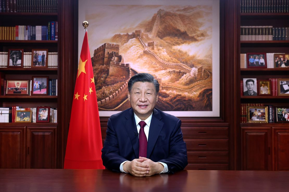 In this photo released by Xinhua News Agency, Chinese leader Xi Jinping delivers a New Year address in Beijing, Saturday, Dec. 31, 2022. 