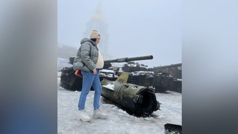 Kateryna in front of seized Russian equipment on Sofiyivska Square, Kyiv