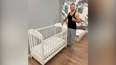Kateryna's husband has put together cots for the twin babies they are expecting.
