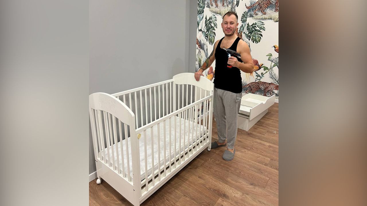 Kateryna's husband has put together  cots for the twin babies they are expecting.