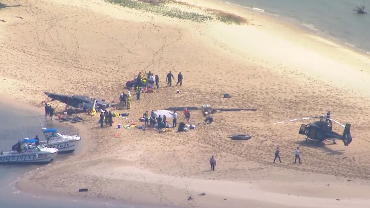 One helicopter crashed onto a sand bank near the shore, while the other was able to land safely.