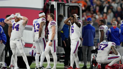 Buffalo Bills players react as teammate Damar Hamlin is examined during the first half of an NFL football game against the Cincinnati Bengals on Monday, January 2.