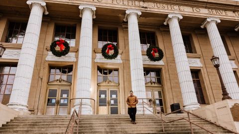 LaTour stands in front of City Hall in Stockton, California.