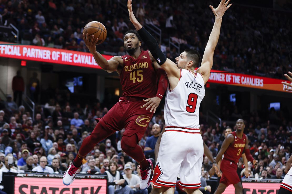 Mitchell (45) shoots against Chicago Bulls center Nikola Vucevic (9).