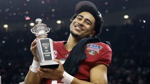 Young holds the Most Outstanding Player trophy as he celebrates after Alabama's victory over Kansas State at the Sugar Bowl.