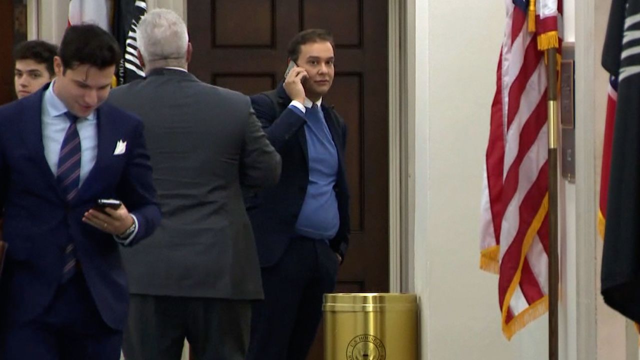 US Rep.-elect George Santos, right, is seen Tuesday in this screen grab on Capitol Hill in Washington.