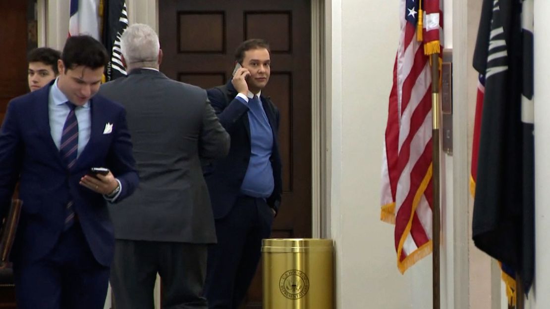 US Rep.-elect George Santos, right, is seen Tuesday in this screen grab on Capitol Hill in Washington.