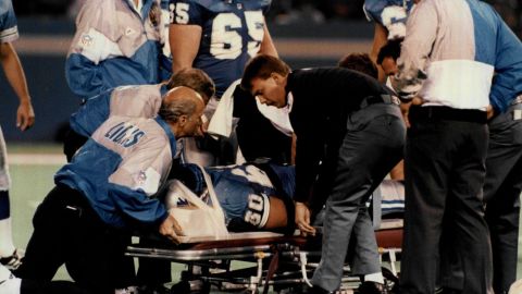 Detroit Lions' Mike Utley stabilized after taking the field in a game in 1991.