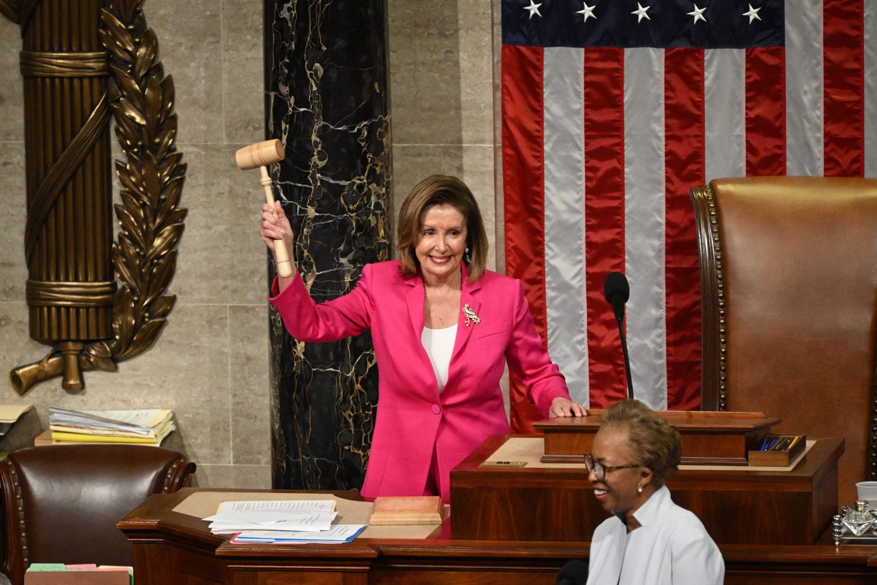 Pelosi holds the gavel after ending the 117th Congress in January 2023.
