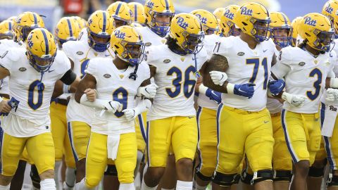 Damar Hamlin (3) and John Petrishen (0) lead Pittsburgh out to play the Austin Peay Governors at Heinz Field in 2020. Pittsburgh won 55-0.