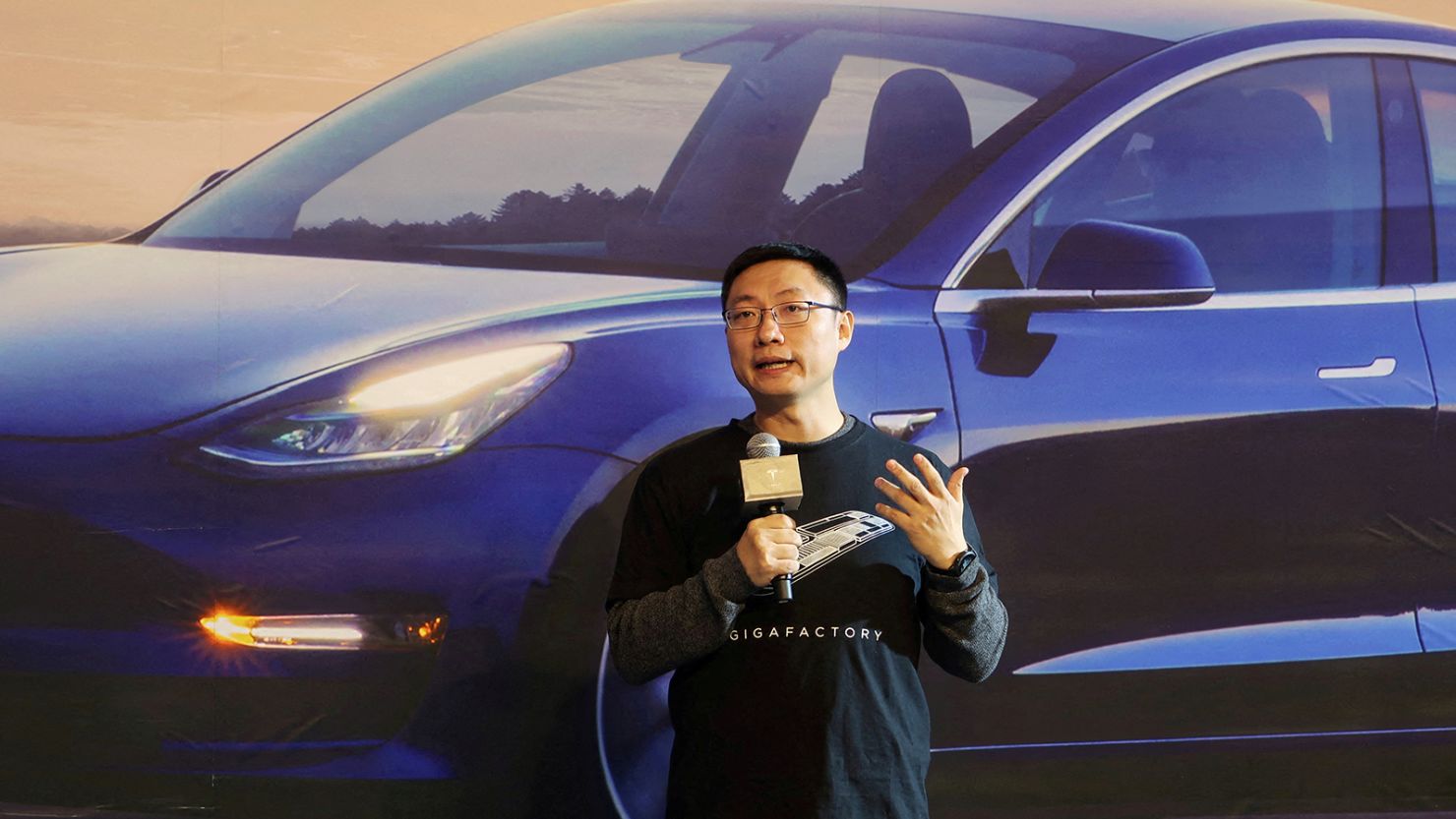 Tesla's China chief Tom Zhu speaks at a delivery ceremony for China-made Tesla Model 3 vehicles in the Shanghai Gigafactory of the US electric car maker in Shanghai, China on December 30, 2019. 