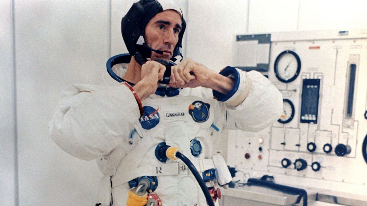 Walt Cunningham adjusts his pressure suit before the Apollo 7 launch on October 11,1968.
