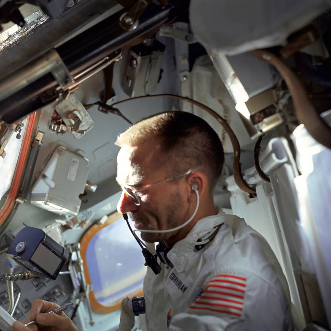 Cunningham writes with a Fisher Space Pen during the flight of Apollo 7, the first crewed Apollo flight and the Space Pen's first trip to space. The pens have been used on every NASA human spaceflight mission since.
