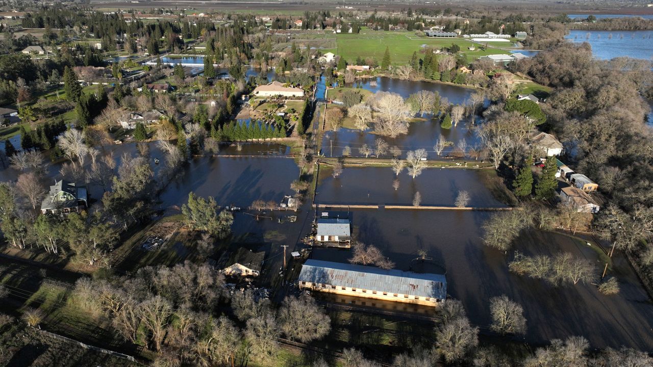 An aerial view of flooded areas around homes on Sunday after heavy rain caused a levee to break, flooding Sacramento County roads and properties near Wilton, California.