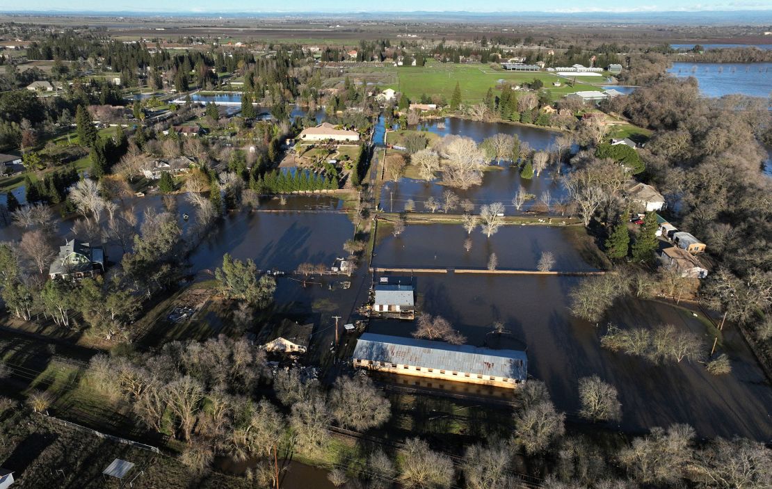 An aerial view of flooded areas around homes on Sunday after heavy rain caused a levee to break, flooding Sacramento County roads and properties near Wilton, California.