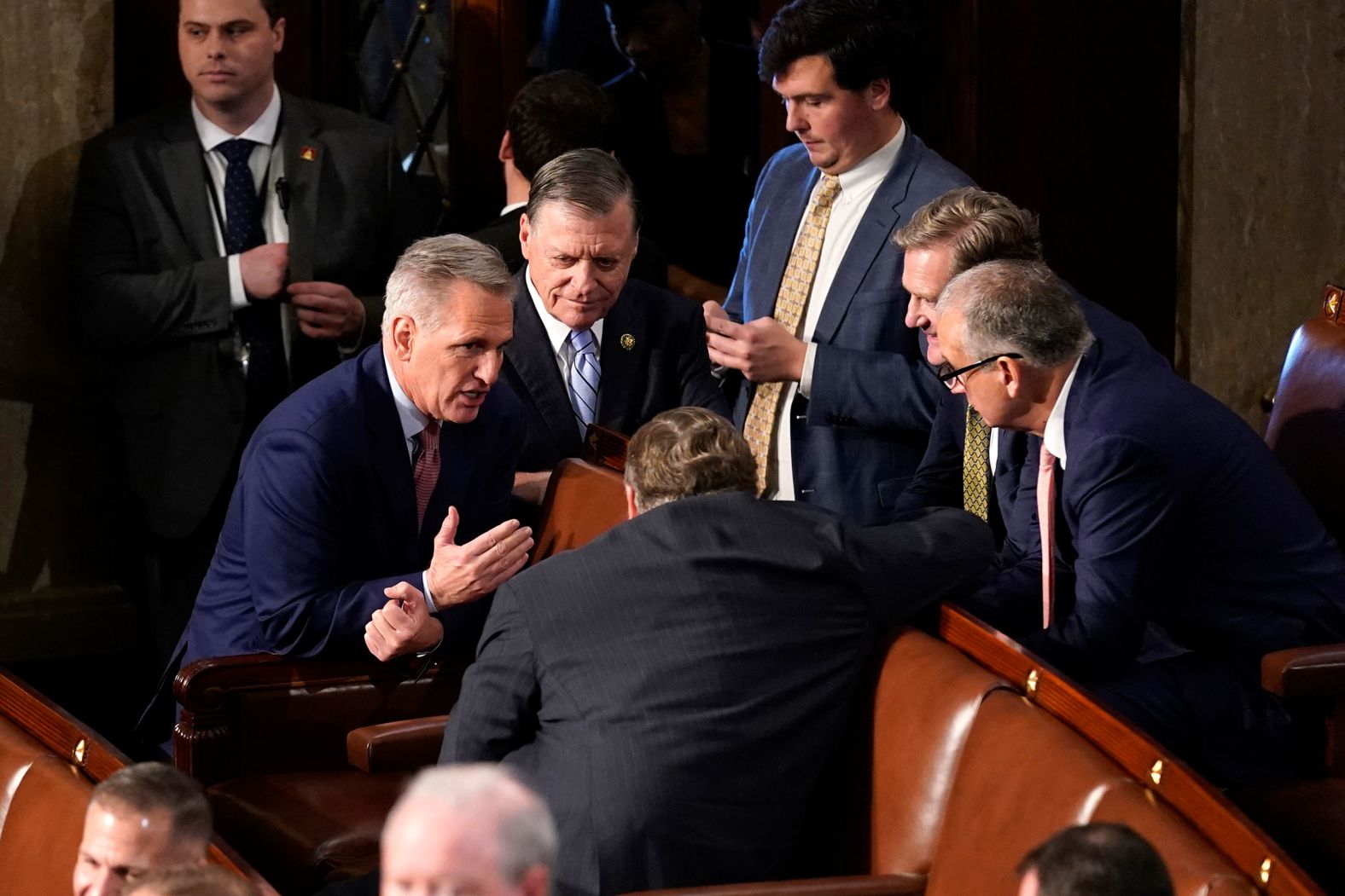 McCarthy talks to other lawmakers after the first vote.