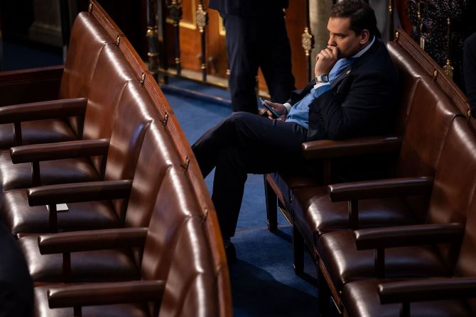 US Rep.-elect George Santos sits alone in the House chamber Tuesday. <a href="index.php?page=&url=https%3A%2F%2Fwww.cnn.com%2Fpolitics%2Flive-news%2Fnew-congress-sworn-in-2023%2Fh_e5ecb07a90c8124c8a1f89de5f3f1430" target="_blank">The embattled New York Republican</a> faces a federal probe into his finances and mounting scrutiny and condemnation over lies about his biography. 