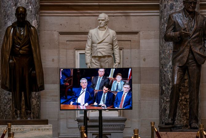 A video monitor at the Capitol displays a live feed of the House chamber on Tuesday.
