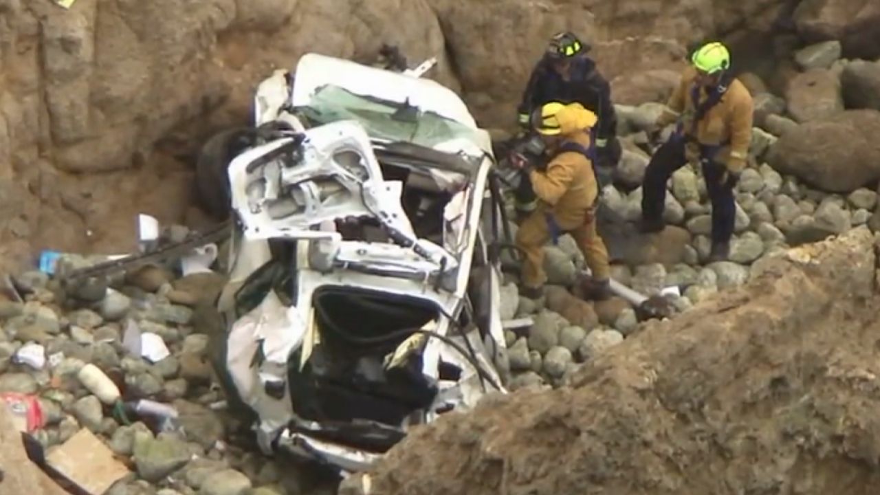 This image from the San Mateo County Sheriff's Office shows the Tesla on a rocky beach below the cliffs, in an area called Devil's Slide.
