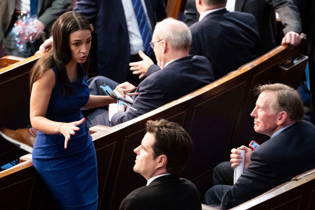 Democratic Rep. Alexandria Ocasio-Cortez speaks to GOP Reps. Matt Gaetz and Paul Gosar on the House floor. Ocasio-Cortez spokesperson Lauren Hitt told CNN that Gosar was asking Ocasio-Cortez if any Democrats were planning to leave the floor or vote present so McCarthy could have a lower threshold, something that hardliners against McCarthy do not want. Ocasio-Cortez, according to Hitt, <a href=