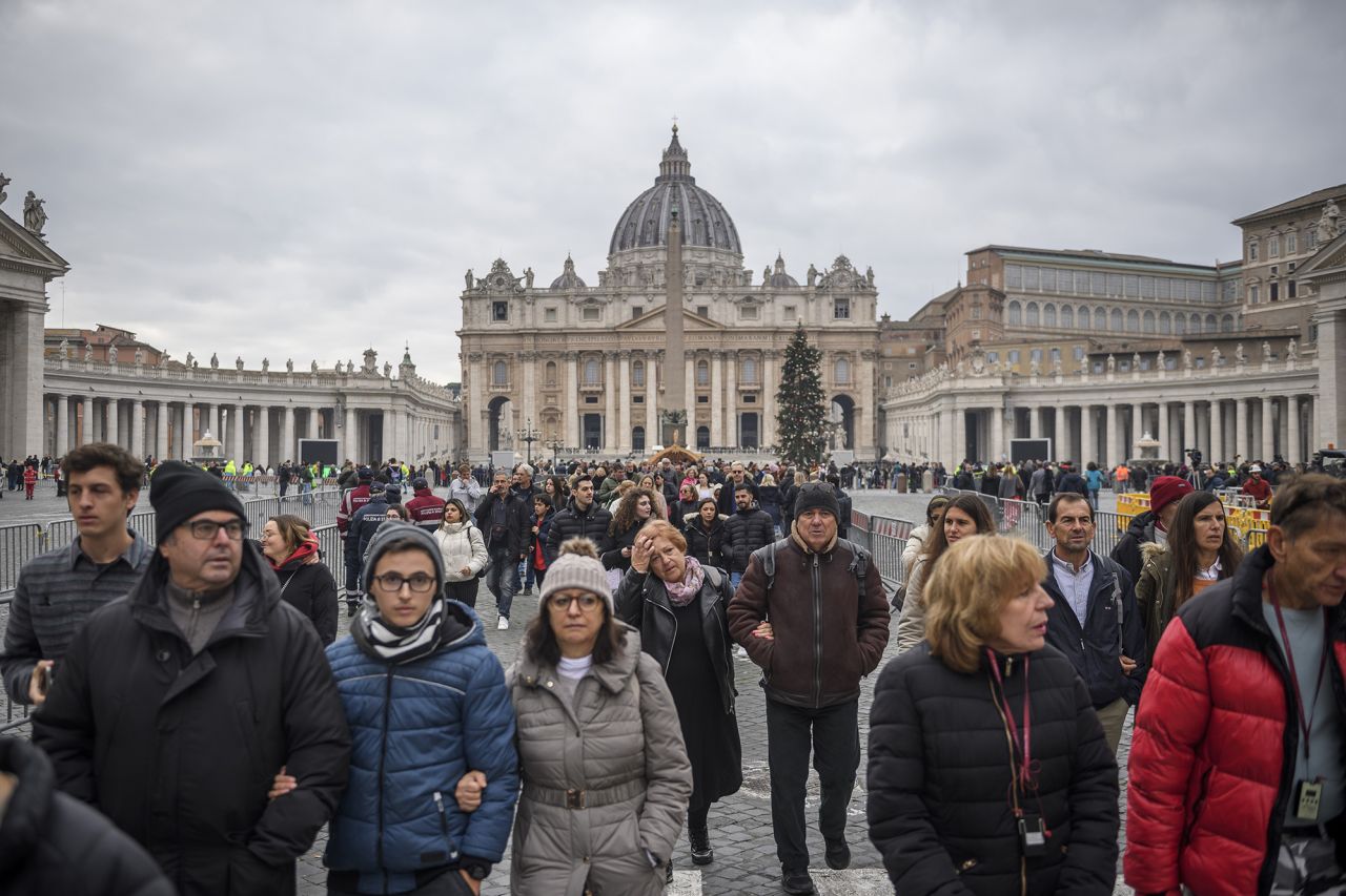 Mourners leave St. Peter's Square after paying their respects to Benedict on Monday.