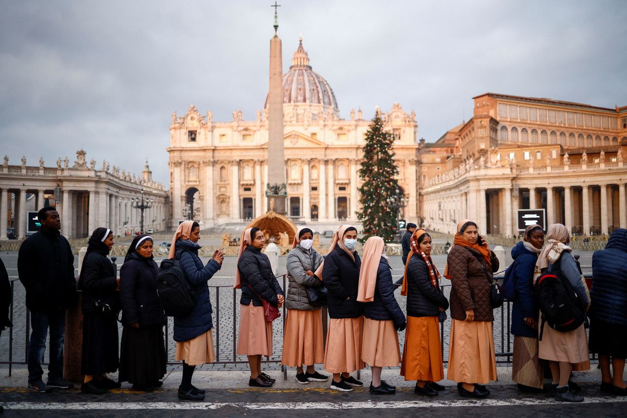 People line up to enter St. Peter's Basilica on Monday.