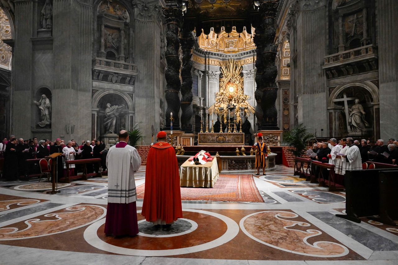 The former Pope's body was moved to St. Peter's Basilica on Monday morning, where it was laid out for the faithful to bid farewell, the Vatican said.