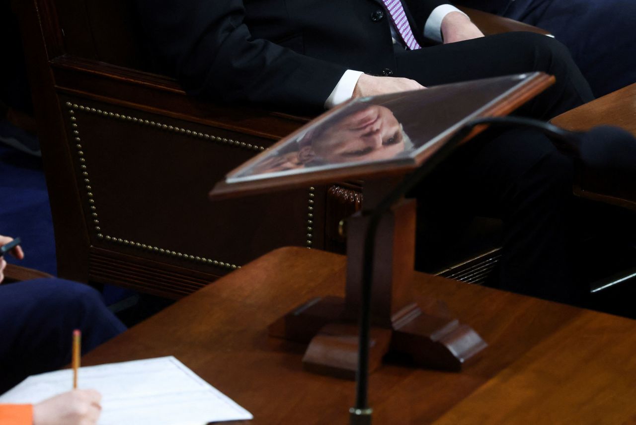 McCarthy is reflected on a podium Wednesday.