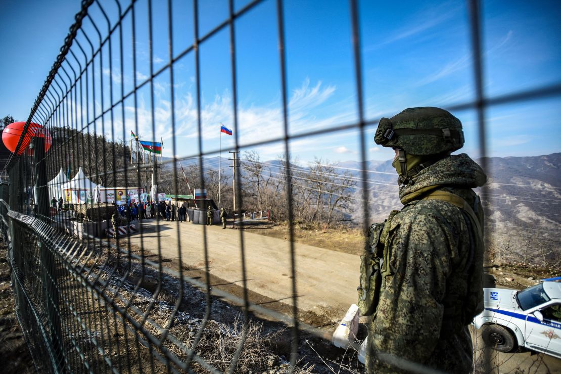 A Russian peacekeeper guards the Lachin Corridor, which has been blocked by Azerbaijani protesters since December 12, 2022 -- cutting off ethnic Armenians of Nagorno-Karabakh from the outside world.