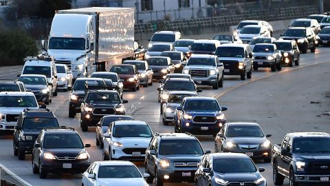Drivers wait in traffic during the morning rush hour commute in Los Angeles, California on February 23, 2022