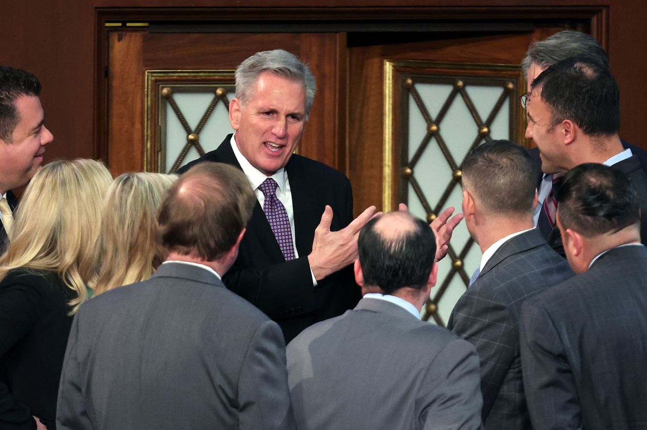 McCarthy talks to colleagues inside the House chamber on Wednesday.