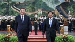 In this photo released by Xinhua News Agency, Visiting Philippine President Ferdinand Marcos Jr., right, walks with Chinese President Xi Jinping after reviewing an honor guard during a welcome ceremony at the Great Hall of the People in Beijing, Wednesday, Jan. 4, 2023. Philippine President Ferdinand Marcos Jr. is pushing for closer economic ties on a visit to China that seeks to sidestep territorial disputes in the South China Sea. 