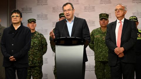 Interior minister Alfonso Prada speaks next to the High Commissioner for Peace, Danilo Rueda (L), and the Minister of Defense, Ivan Velasquez (R), during a press conference in Bogota on January 4, 2023. 
