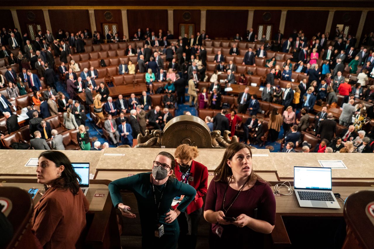 Reporters in the press gallery look at results of the vote to adjourn on Wednesday.