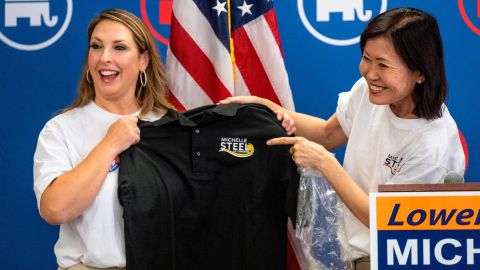 McDaniel accepts a shirt from Rep. Michelle Steel at the congresswoman's campaign office in Buena Park, California, in September 2022.