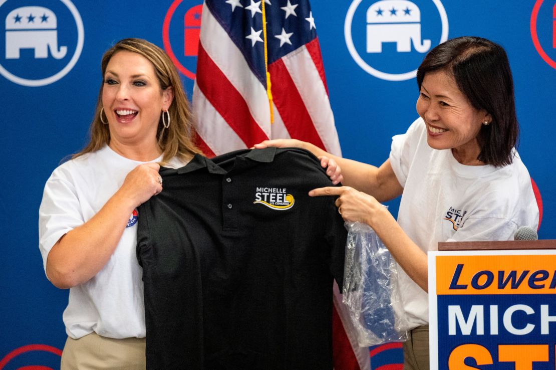 McDaniel accepts a shirt from Rep. Michelle Steel at the congresswoman's campaign office in Buena Park, California, in September 2022.