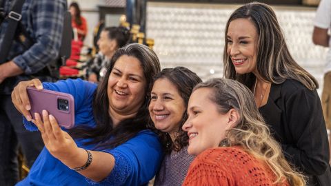 De La Cruz takes a selfie with supporters in McAllen, Texas, in October 2022.