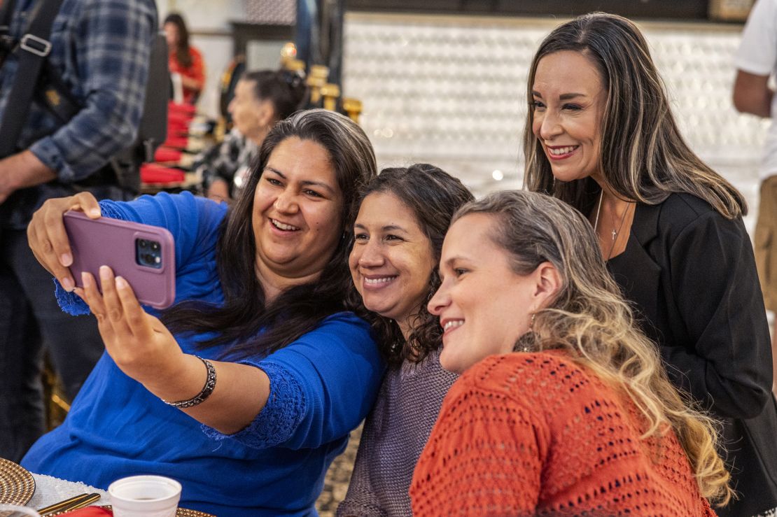 De La Cruz takes a selfie with supporters in McAllen, Texas, in October 2022. 