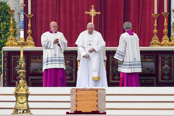 Pope Francis stands by the coffin of Pope Emeritus Benedict XVI during his funeral mass at St. Peter's Square in the Vatican.