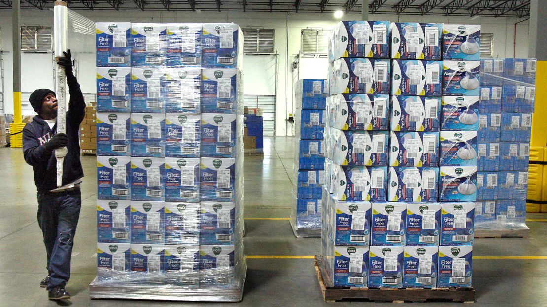 An employee secures a pallet of merchandise at Helen of Troy distribution center in Olive Branch, Mississippi, in March 2014.