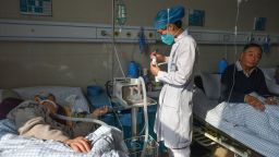 A nurse treats patients infected with Covid-19 at at hospital in eastern China on January 4, 2023.