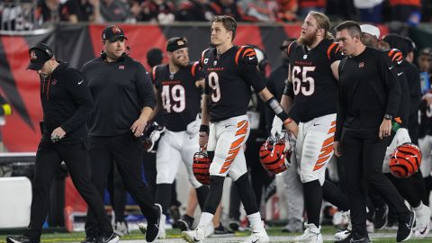 Cincinnati Bengals players leave the field as their game against the Buffalo Bills is suspended following Damar Hamlin's collapse. 