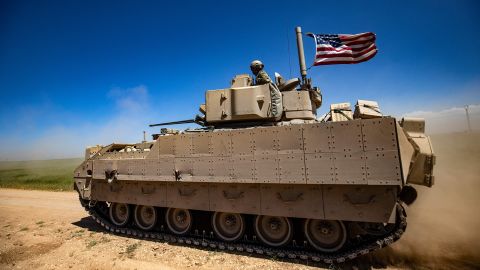 A US Bradley Fighting Vehicle (BFV) patrols the countryside of the Kurdish-majority city of Qamishli in Syria's northeastern Hasakeh province, on April 20, 2022.