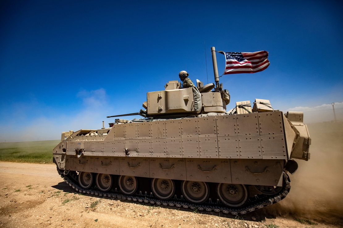 A US Bradley Fighting Vehicle (BFV) patrols the countryside of the Kurdish-majority city of Qamishli in Syria's northeastern Hasakeh province, on April 20, 2022. 