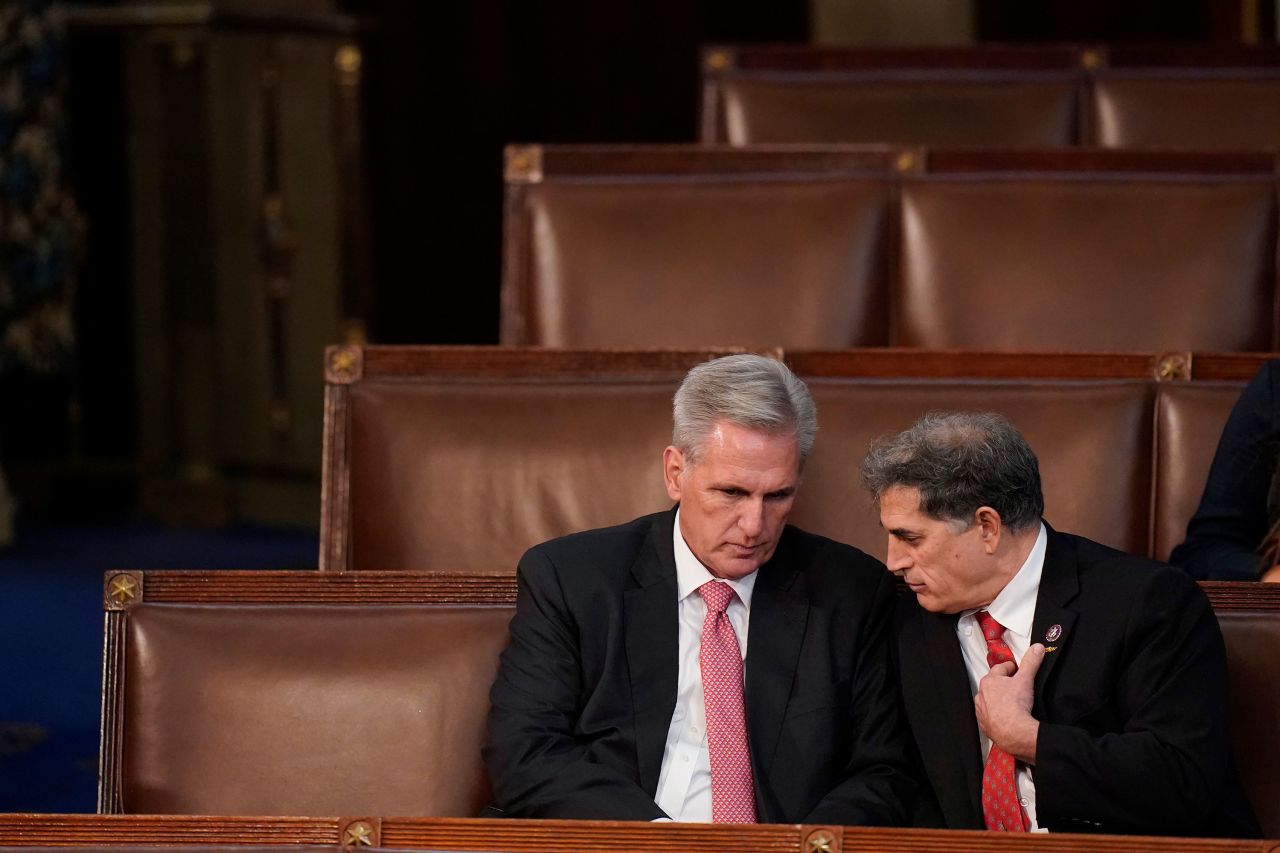 McCarthy, left, talks with US Rep. Andrew Clyde after the failed seventh vote. Clyde, from Georgia, was one of the Republicans who initially voted against McCarthy getting the speakership.