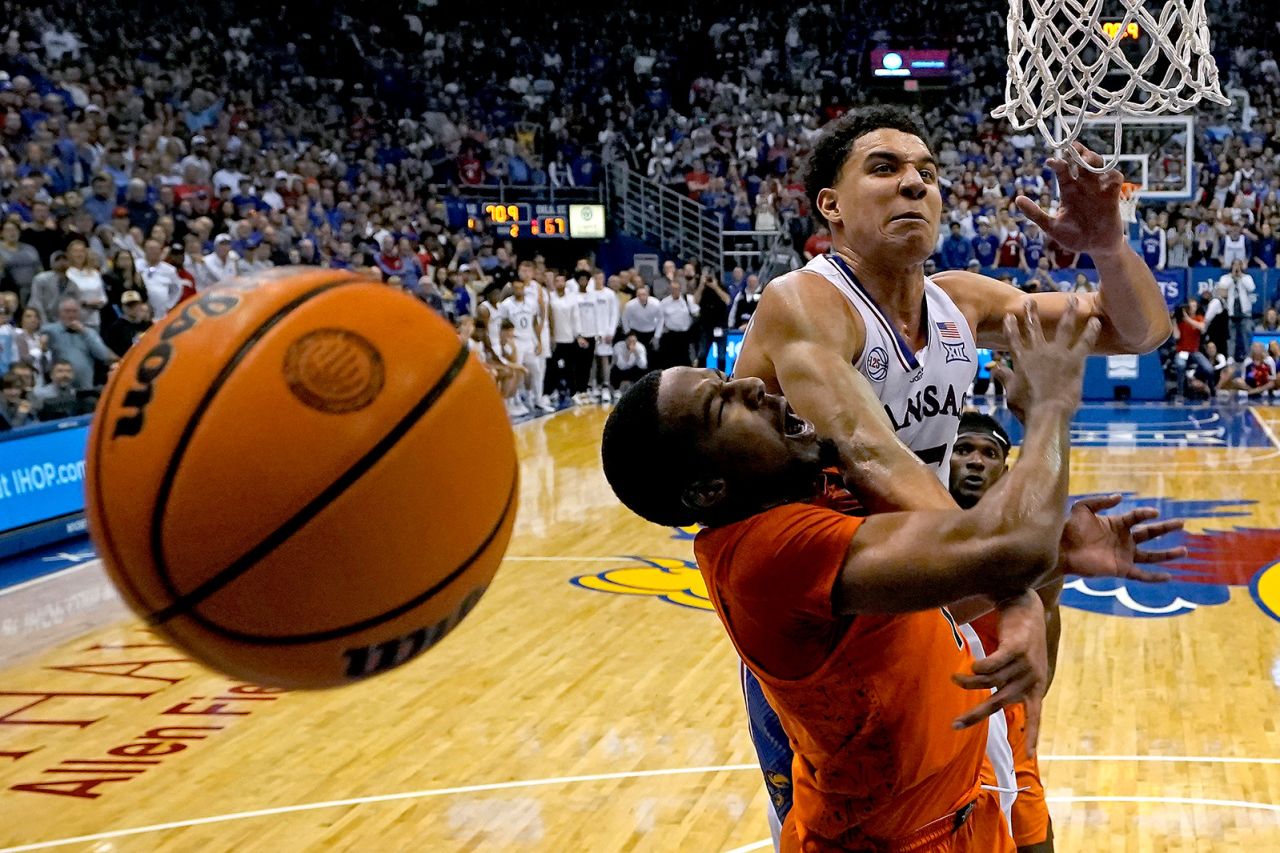Kansas guard Kevin McCullar Jr., top, knocks the ball away from Oklahoma State guard Bryce Thompson during a college basketball game in Lawrence, Kansas, on Saturday, December 31.